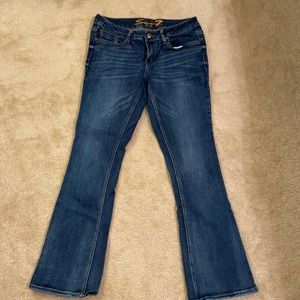 Seven7 Jeans. Bootcut with sparkles on back pockets.